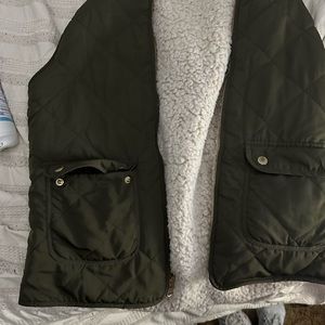 I’m selling my olive green furred lined vest. I got it from a boutique.